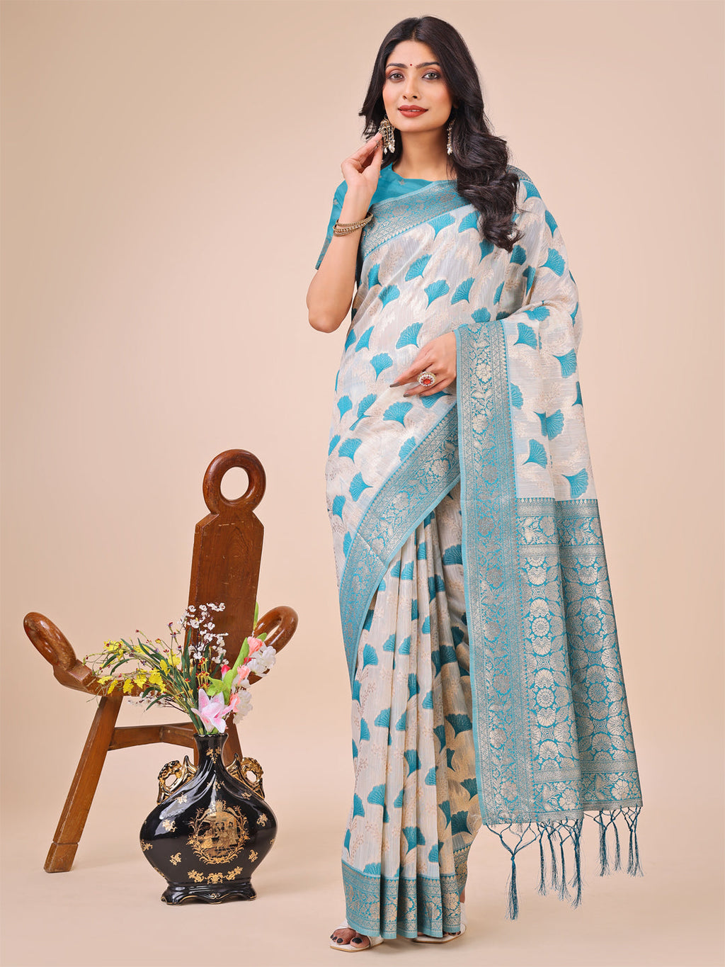Elegant off-white and teal linen cotton saree with zari border