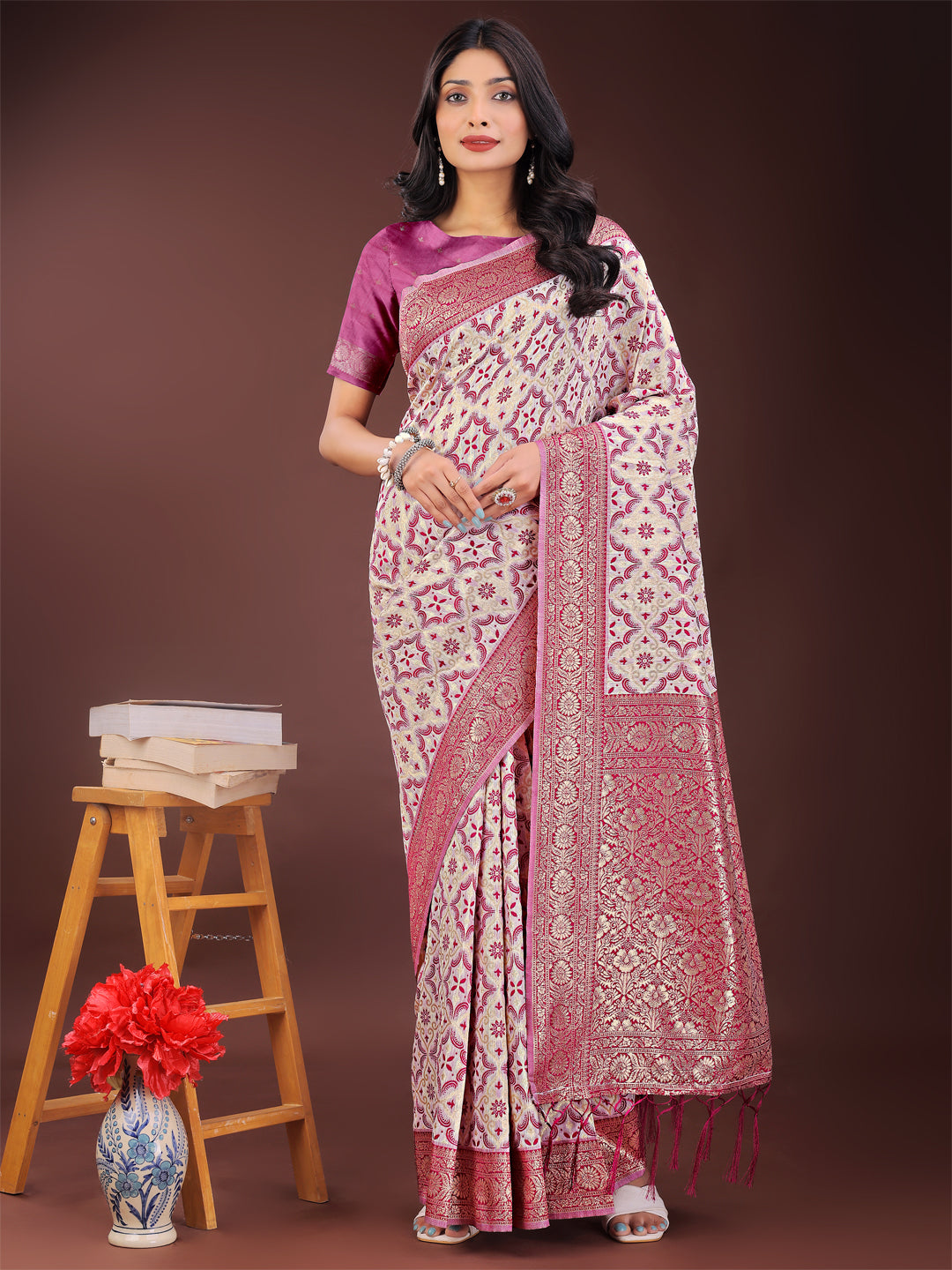 Pink and ivory linen saree with zari floral motifs and traditional border