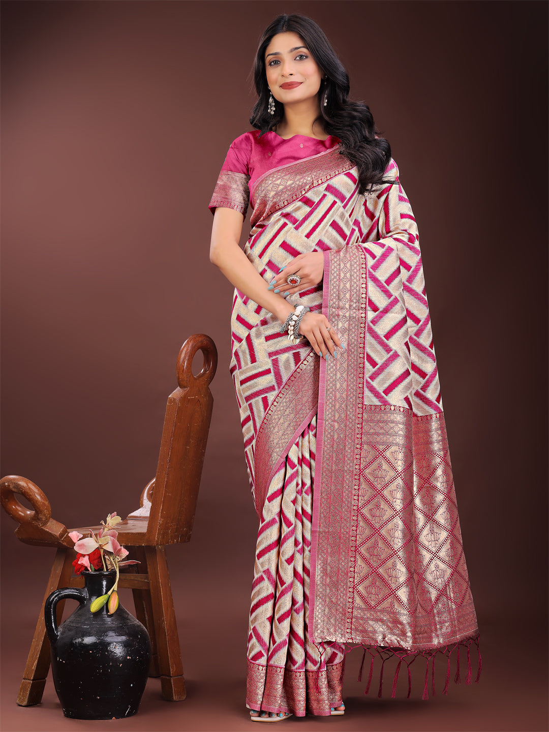 Pink and cream linen saree with geometric pattern and gold zari border