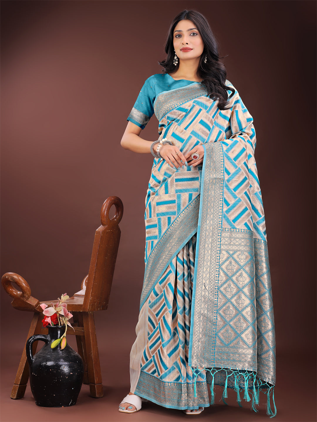 Sea Green and Cream linen saree with geometric patterns and metallic zari border