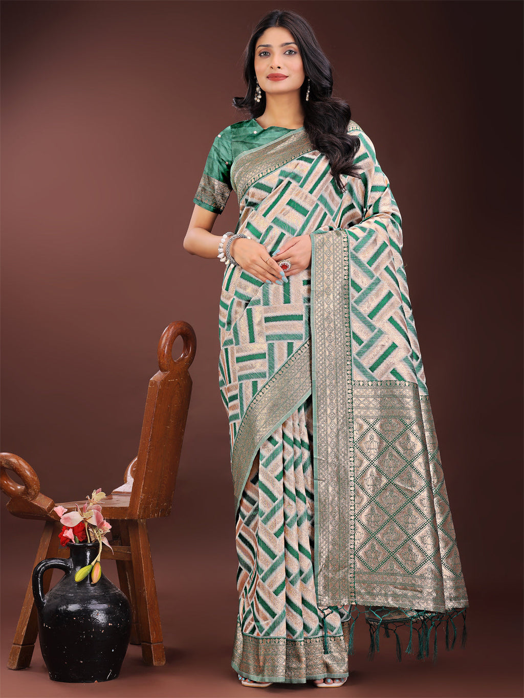 Green and cream linen saree with geometric patterns and zari border