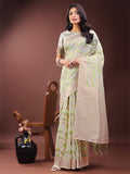 Elegant beige and coral linen saree featuring an abstract print and a traditional Zari border.