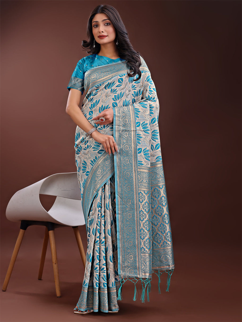 Beige and sea green linen saree with floral print and gold zari details