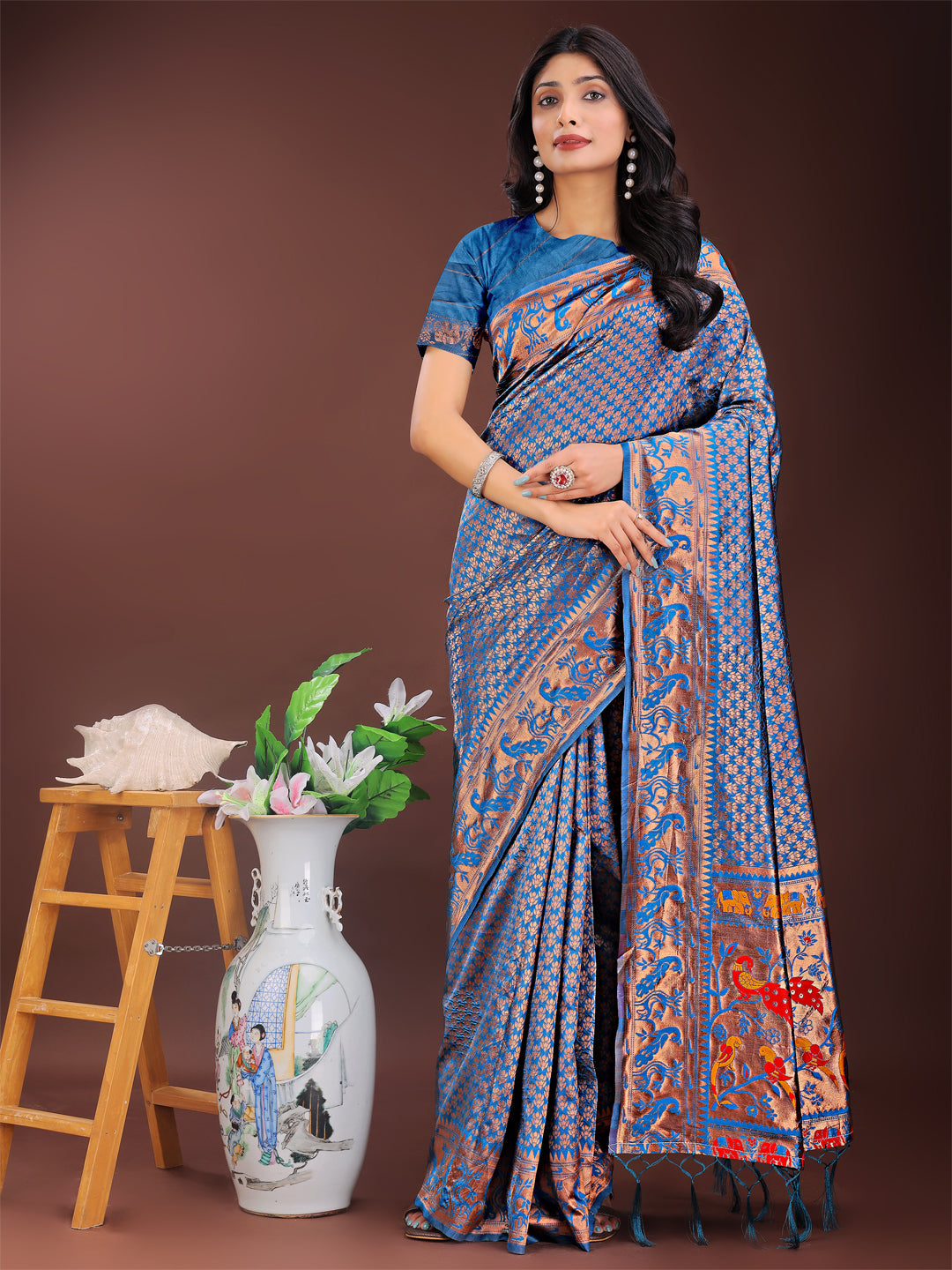 Fiery Blue Banarasi silk saree with gold zari borders and a colorful pallu draped elegantly