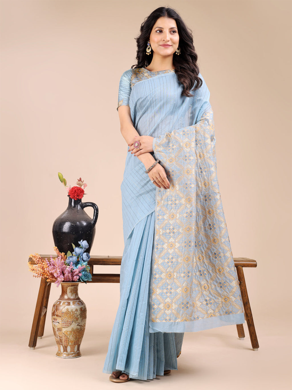 Sky blue cotton saree with woven zari work and traditional tassel detailing
