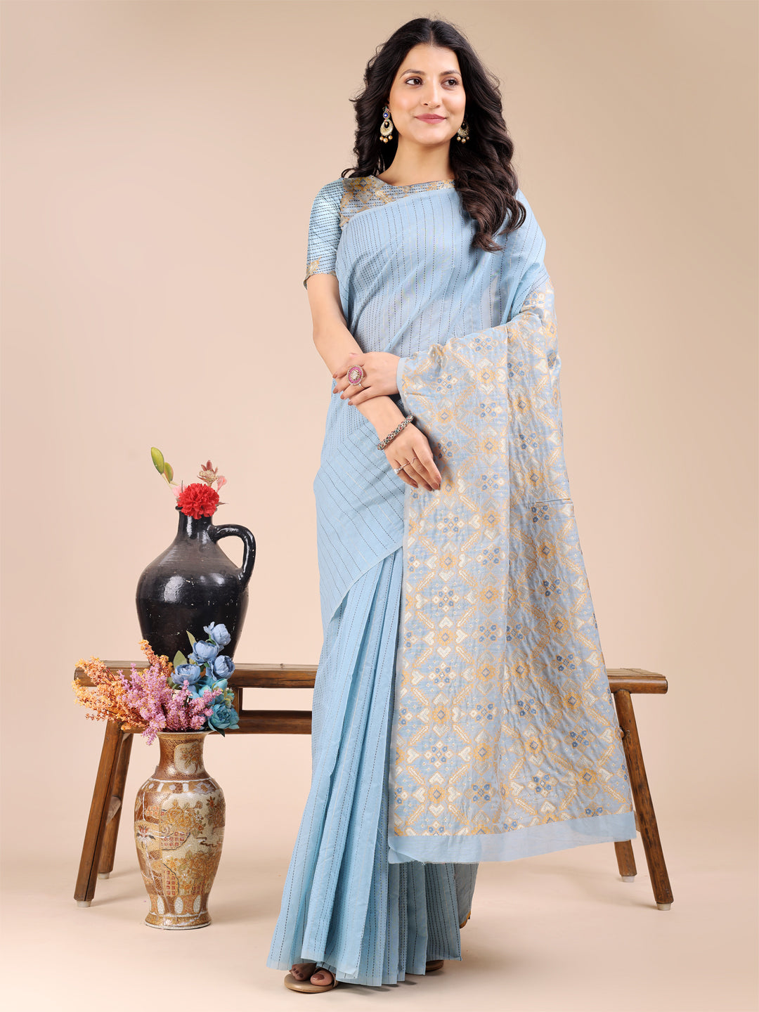 Sky blue cotton saree with woven zari work and traditional tassel detailing