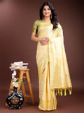 Elegant yellow linen cotton saree with delicate woven patterns and subtle shimmer.