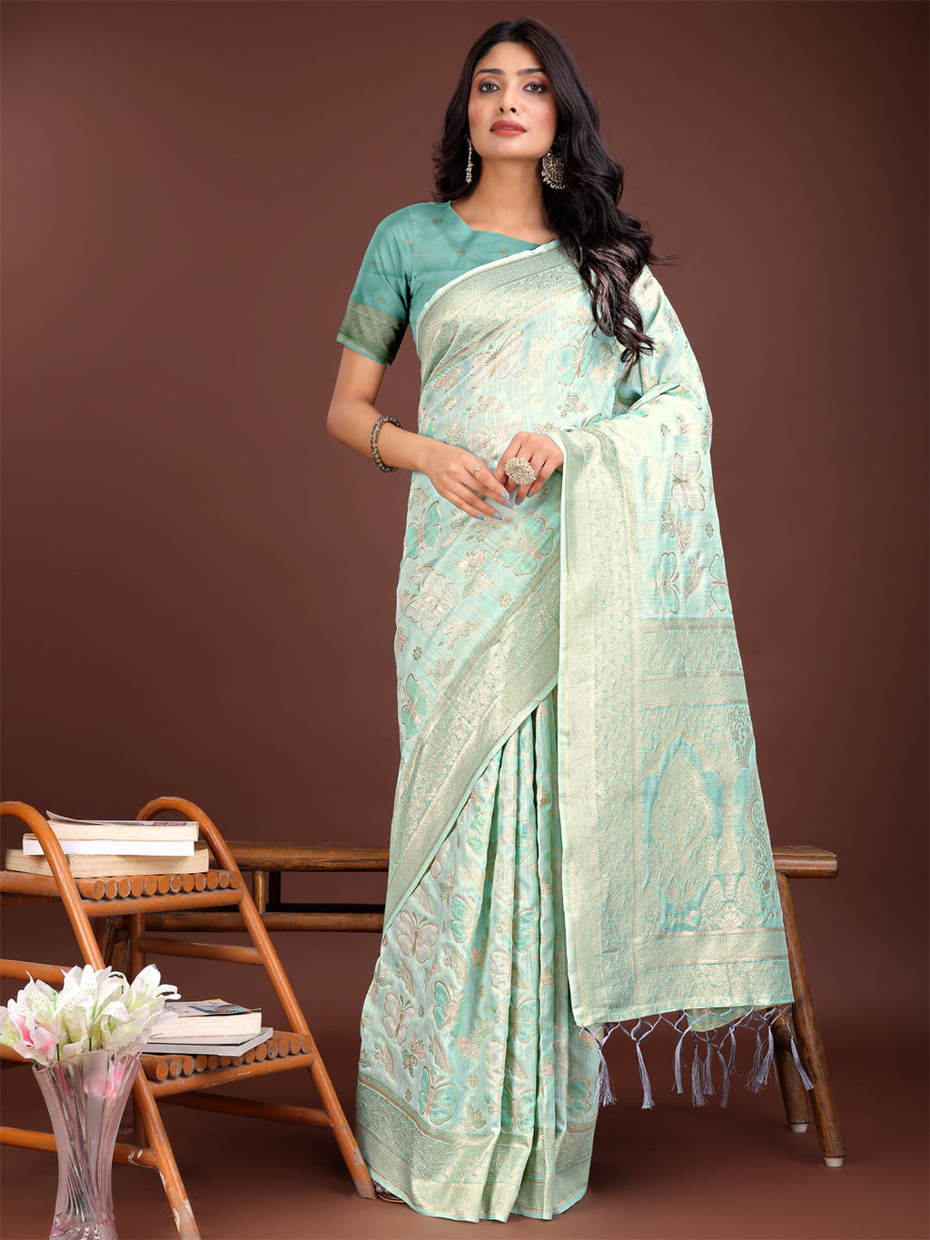 Sea Green cotton saree adorned with shimmering golden zari work and a detailed pallu.
