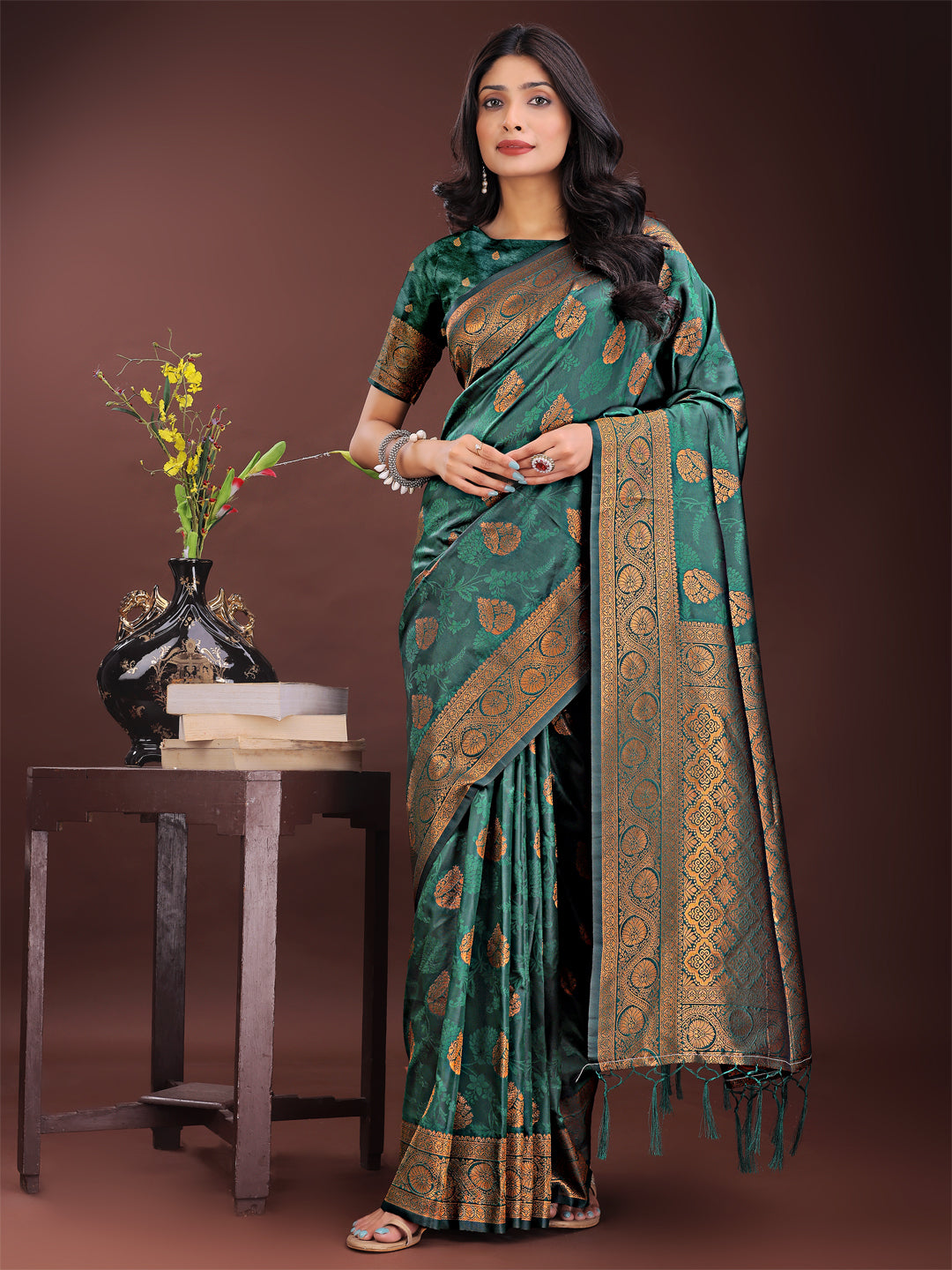 Majestic dark green Banarasi silk saree with intricate golden zari border and motifs