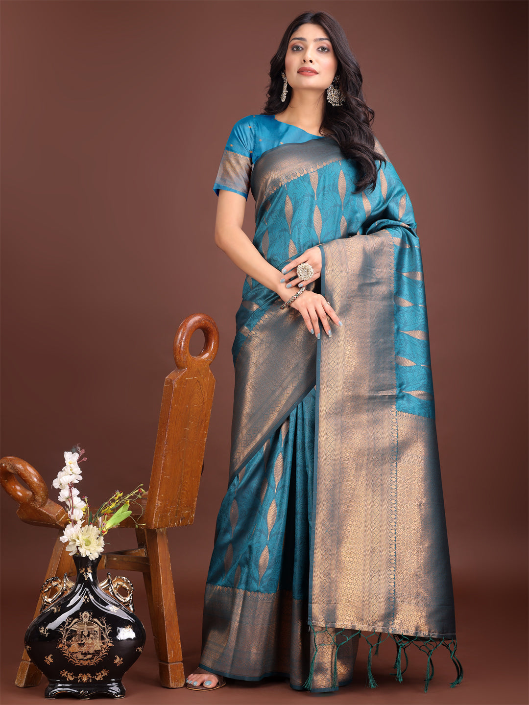 Teal blue linen cotton saree with golden zari leaf patterns and rich pallu