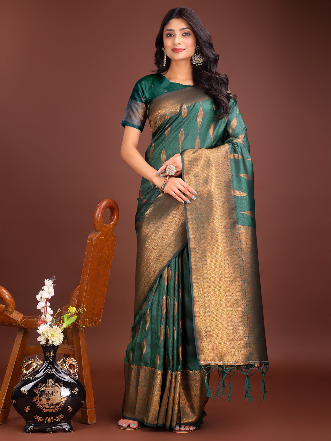 Green linen cotton saree with golden zari leaf motifs and rich pallu