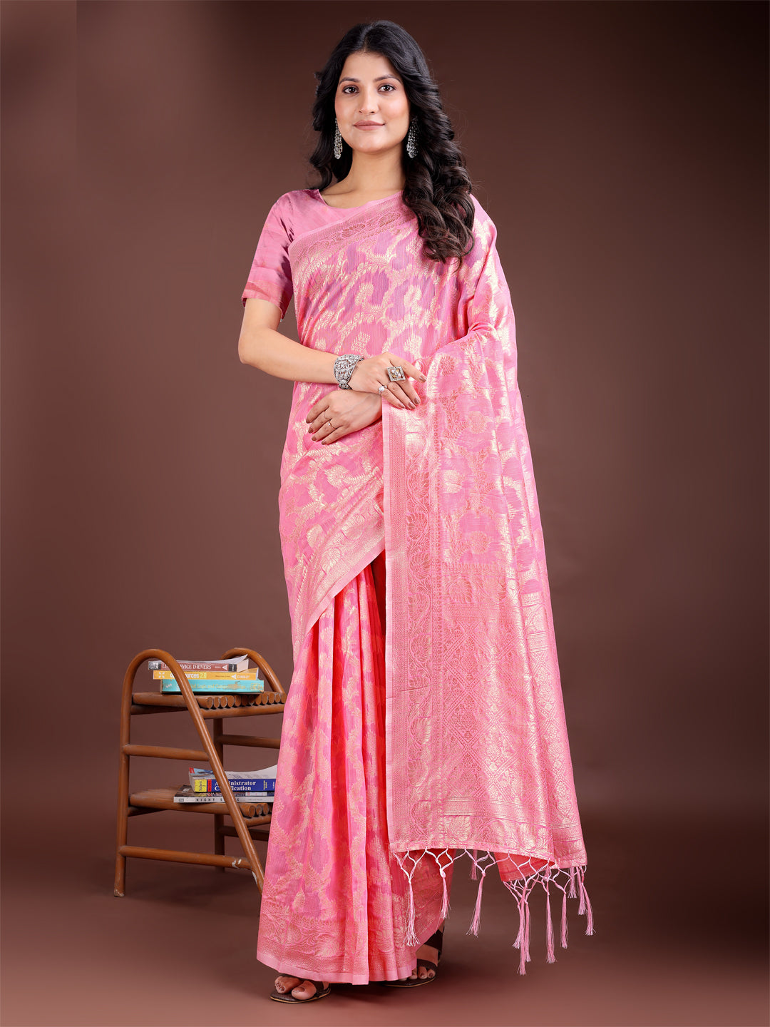 Bright pink linen cotton saree with gold zari work and pallu tassels