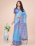 Sky blue Lichi silk saree featuring floral woven motifs and a pallu with decorative tassels.