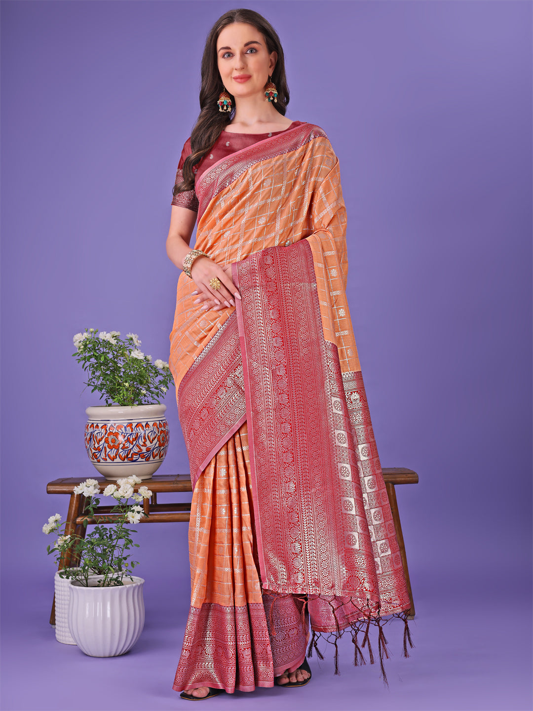 Orange and Red Lichi silk saree featuring a detailed woven border and contrast blouse