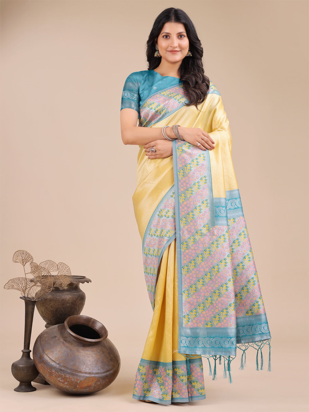 Radiant yellow silk saree with pink and blue floral patterns