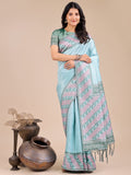 Teal silk saree with detailed pink and blue floral pattern