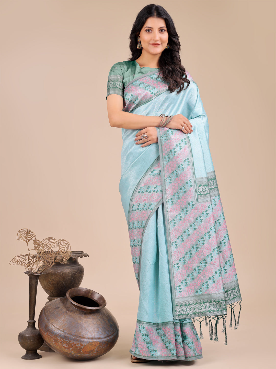 Teal silk saree with detailed pink and blue floral pattern