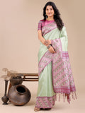 Light green silk saree with soft pink and blue floral motifs