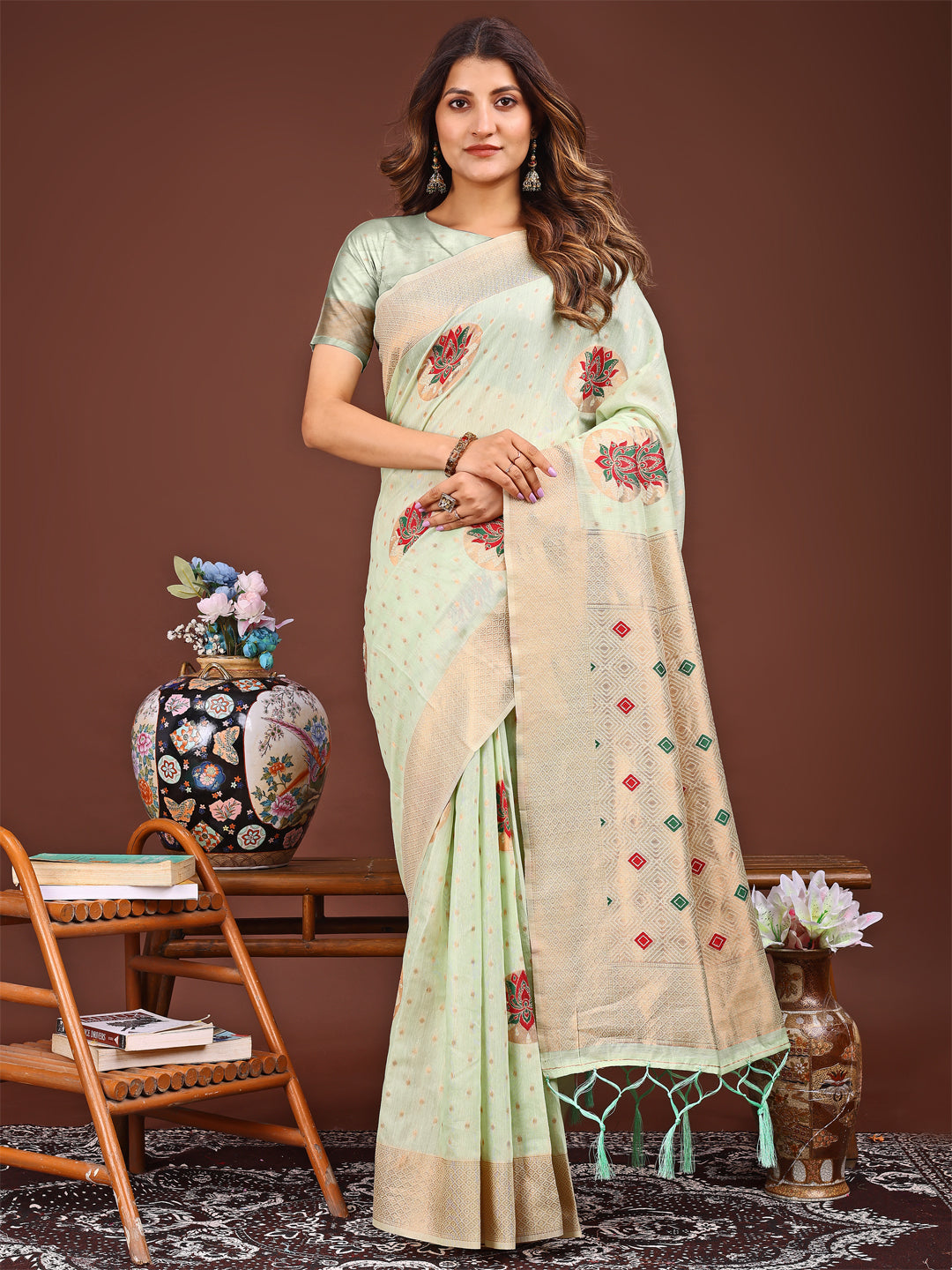 Light green saree with delicate woven work patterns