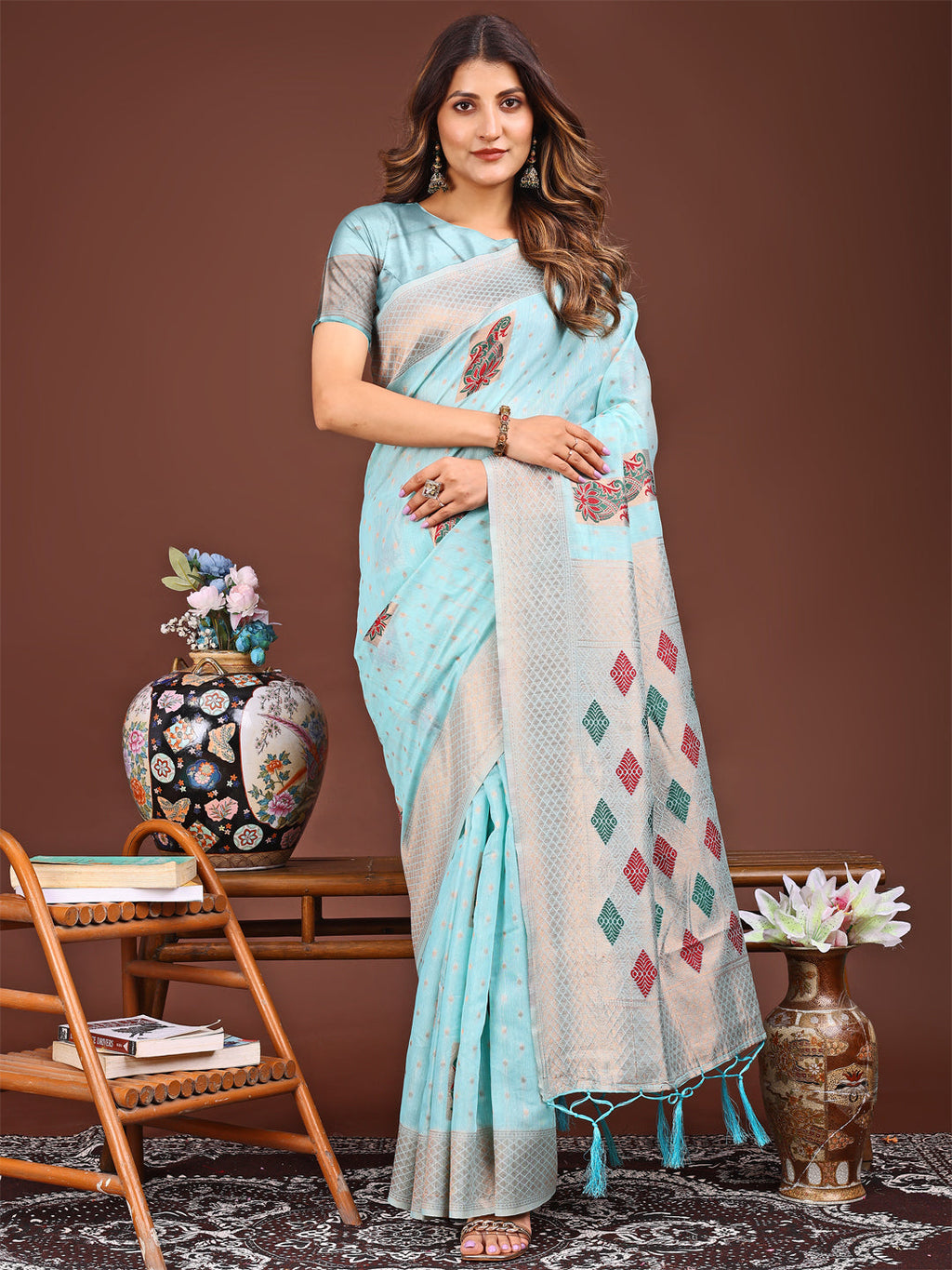 Sky blue jacquard saree featuring intricate patterns and tassel-trimmed pallu edge