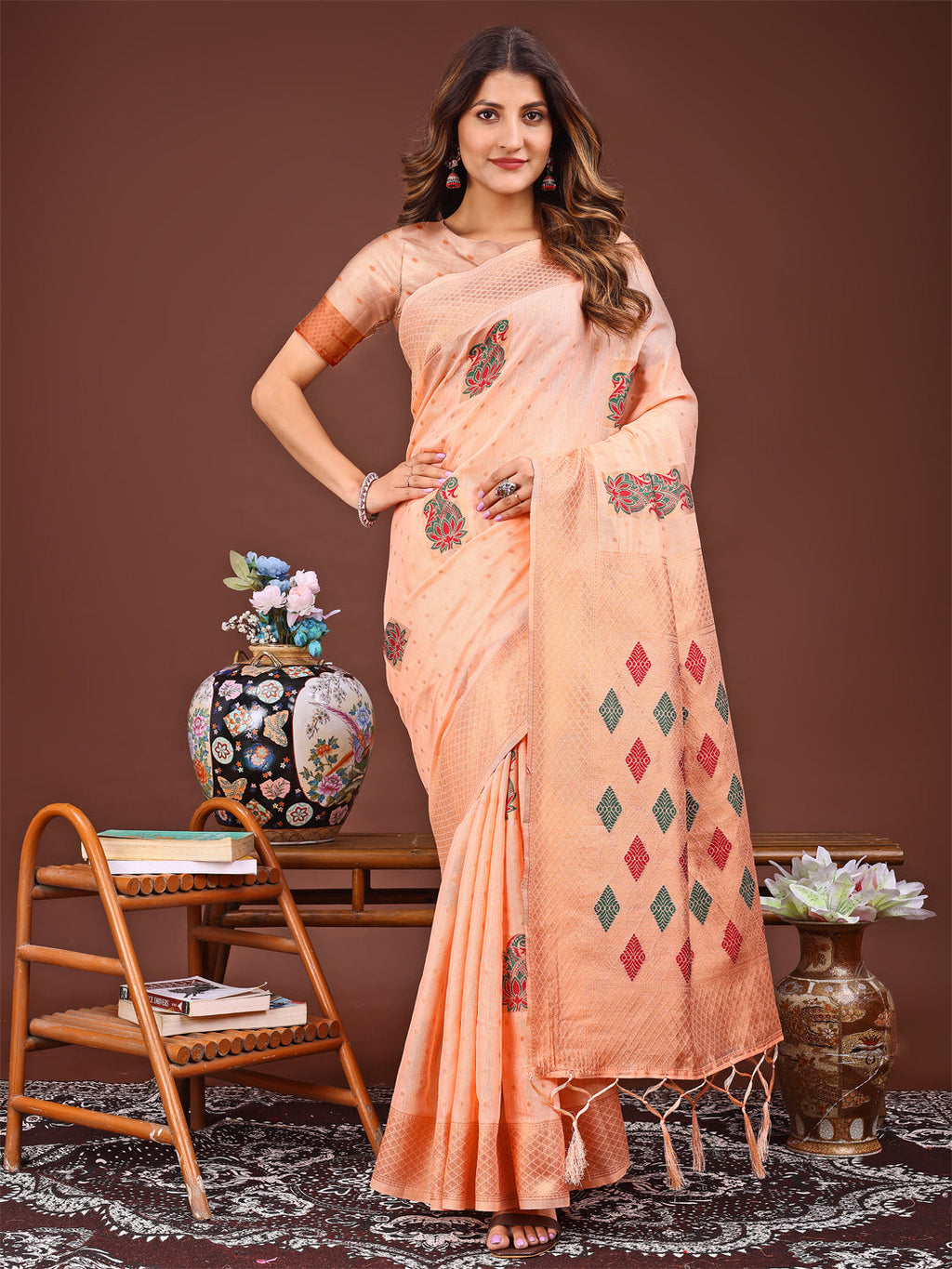 Vibrant orange Jacquard saree adorned with elegant tassels on the pallu.