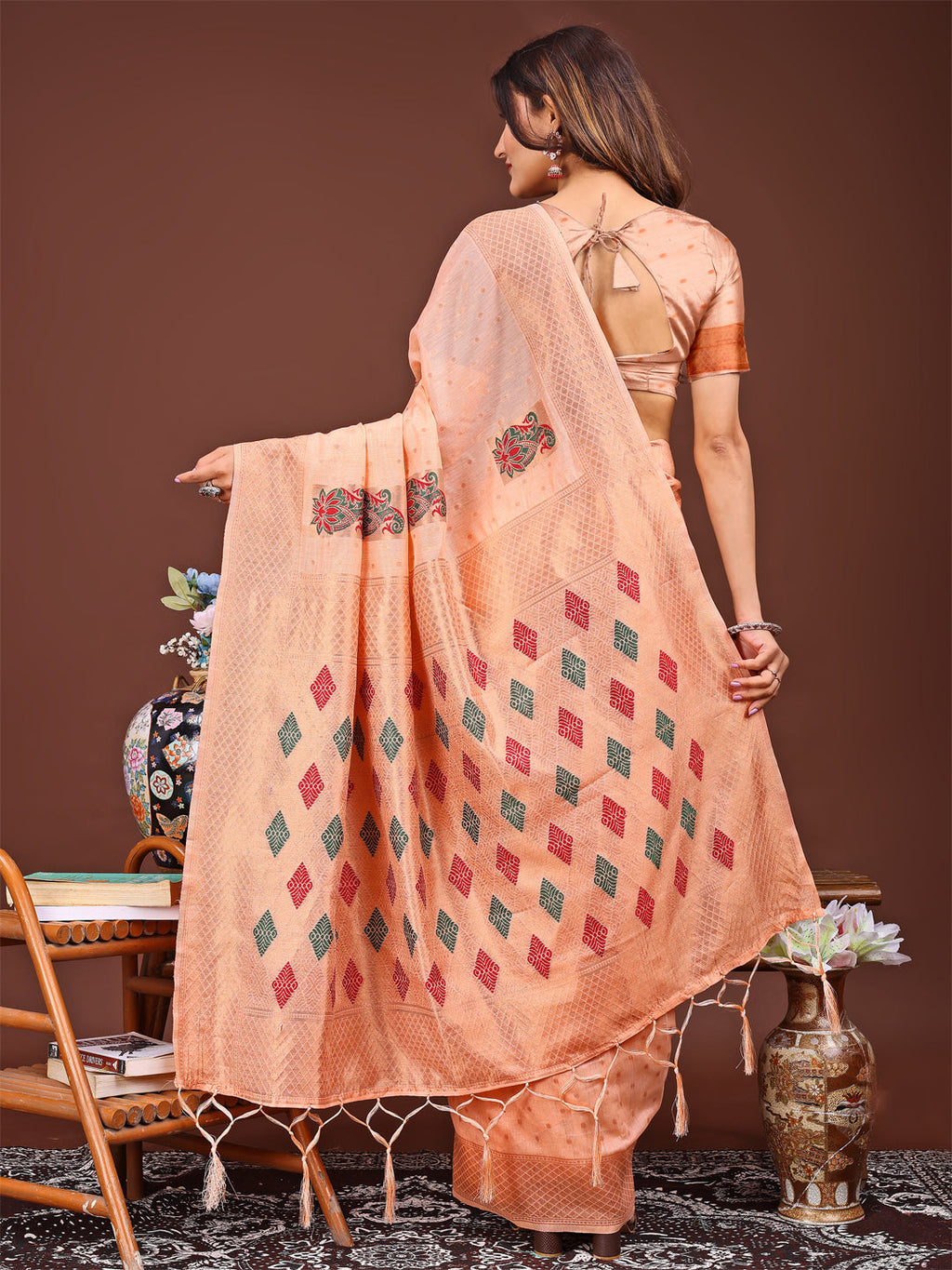 Orange Jacquard Saree with Decorative Tassels and Woven Texture