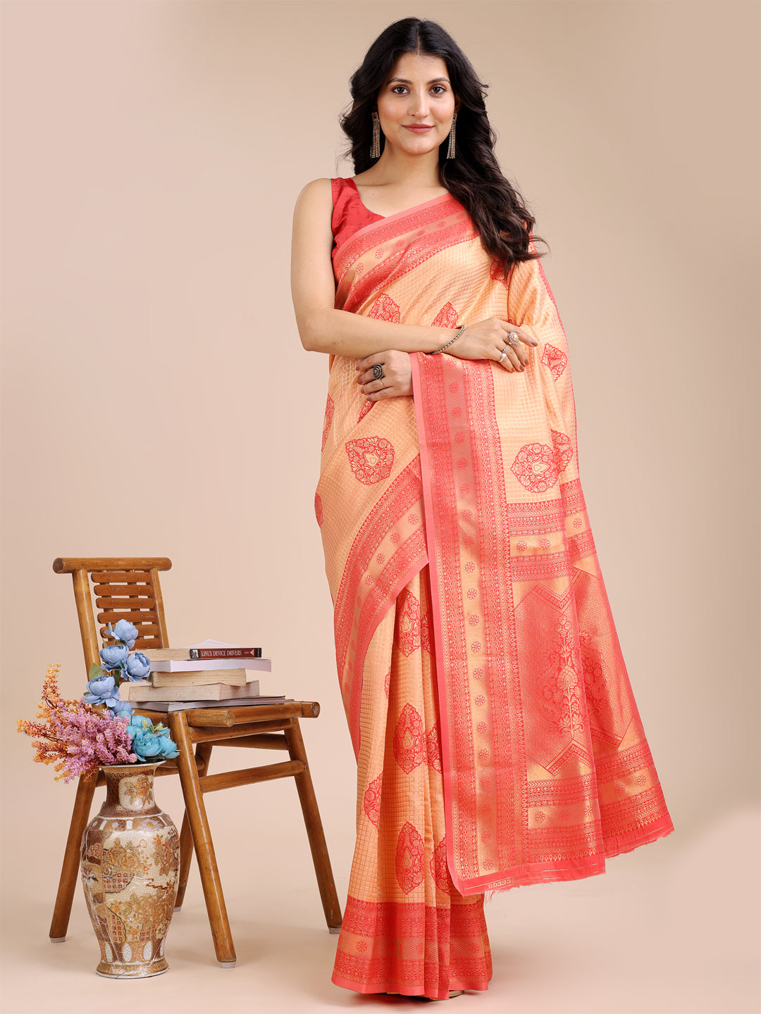 Rich orange and red Banarasi silk saree featuring detailed zari work and traditional tassels