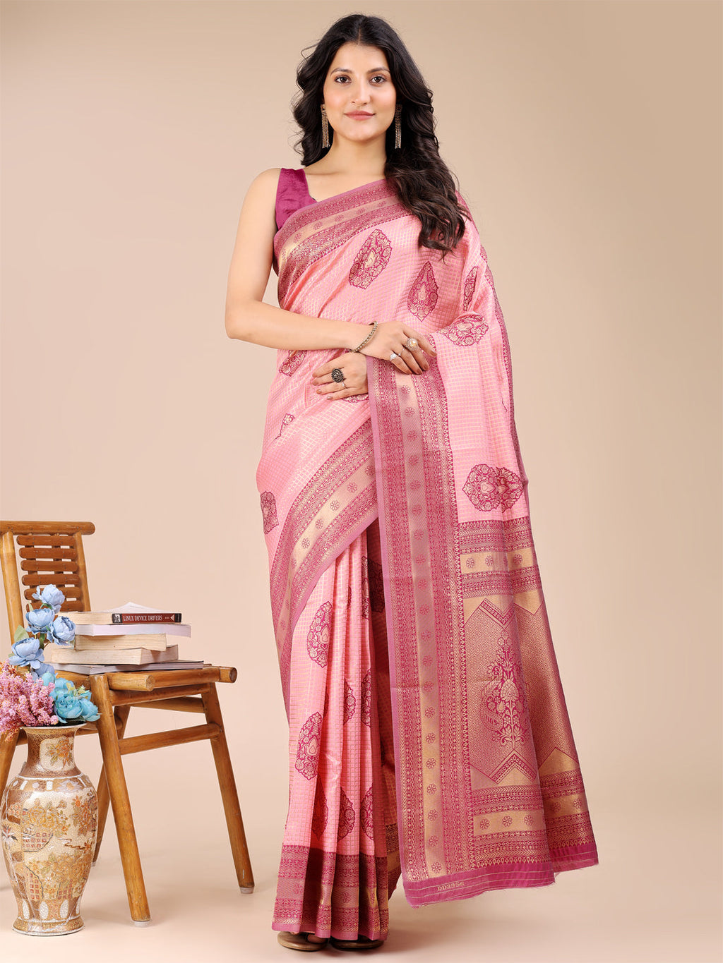 Light pink and magenta Banarasi silk saree with traditional woven zari border and tassels