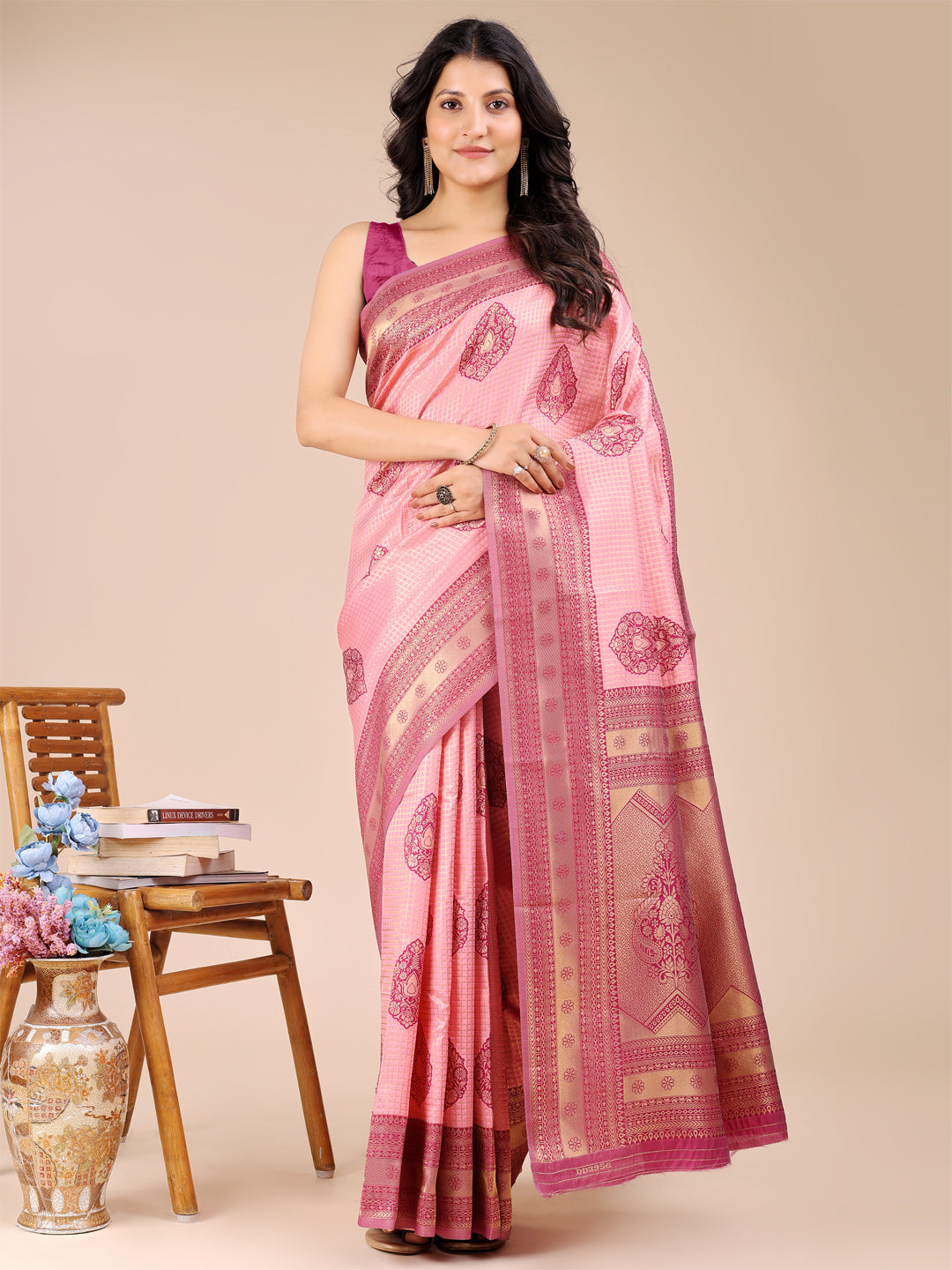 Light pink and magenta Banarasi silk saree with traditional woven zari border and tassels