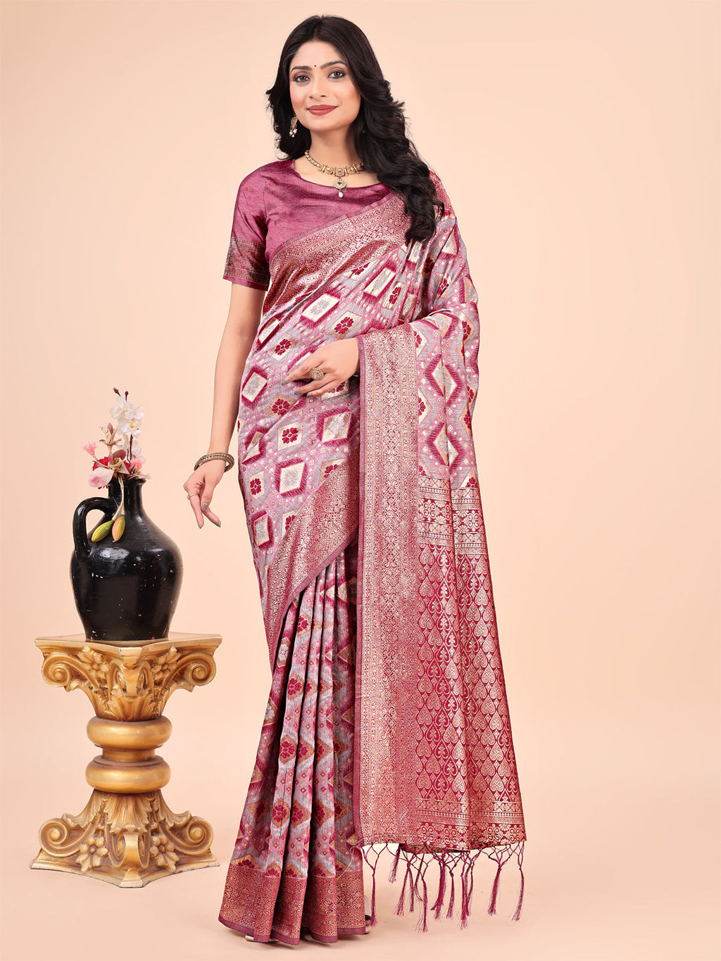 Pink Lichi silk saree with contrast blue woven border and intricate floral zari design