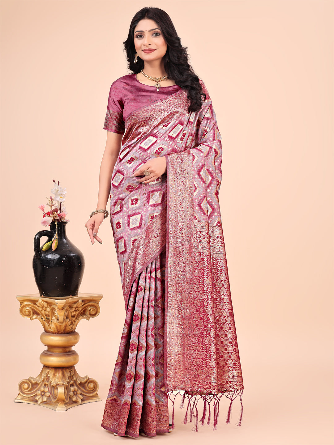 Pink Lichi silk saree with contrast blue woven border and intricate floral zari design