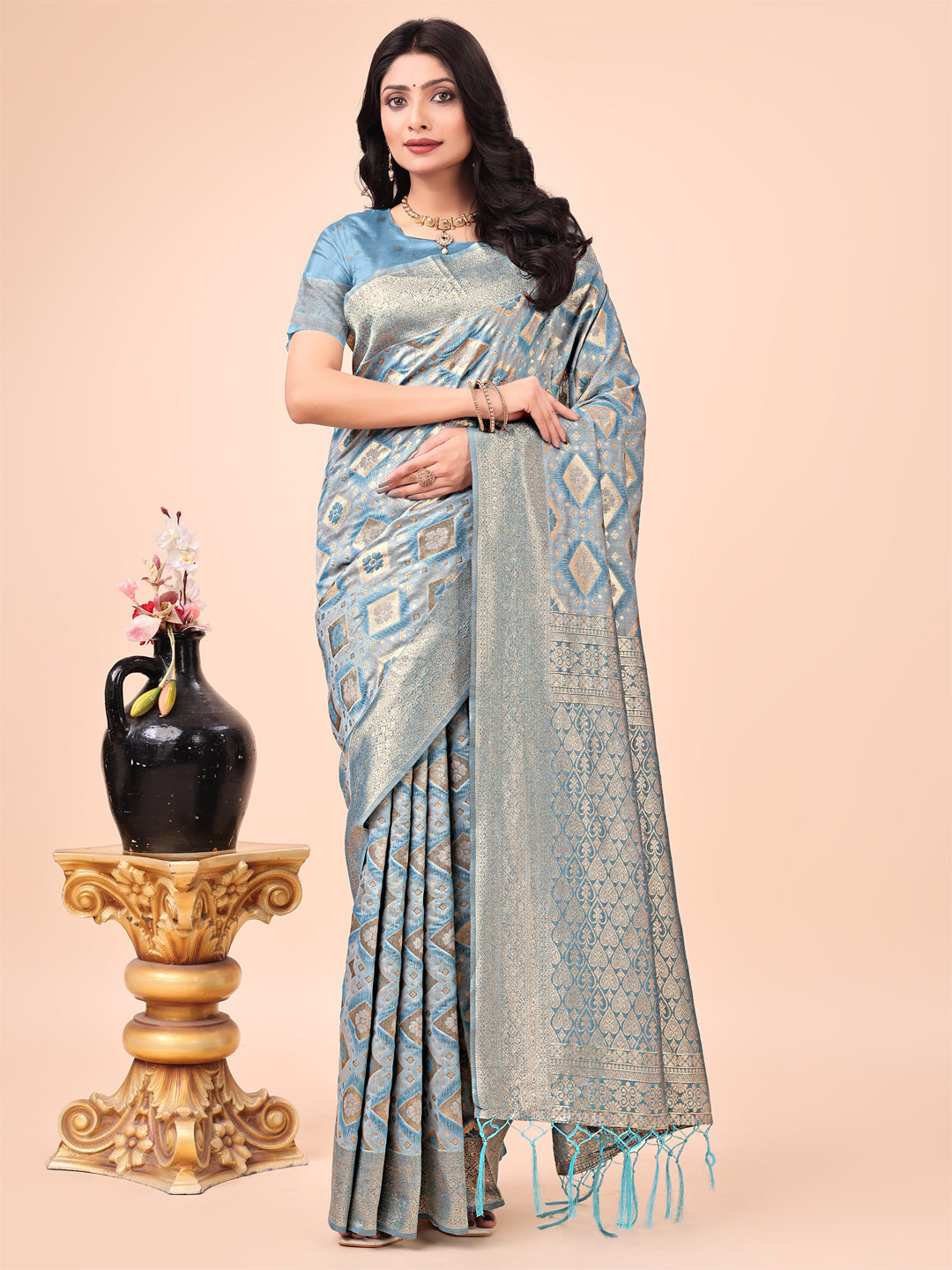 Sky blue lichi silk saree with floral zari motifs and contrast woven border