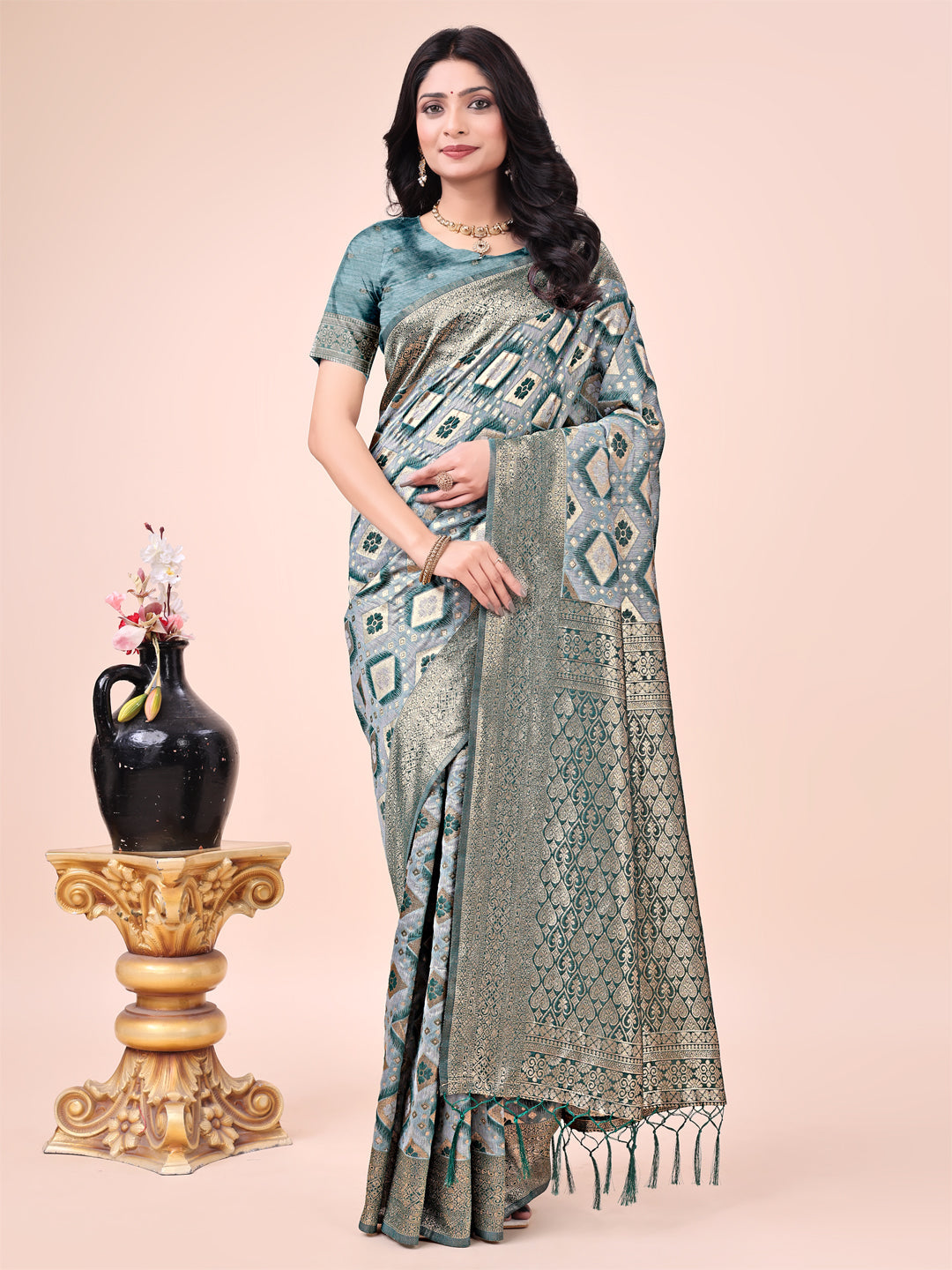 Green Lichi silk saree with contrast blue woven border and floral zari details