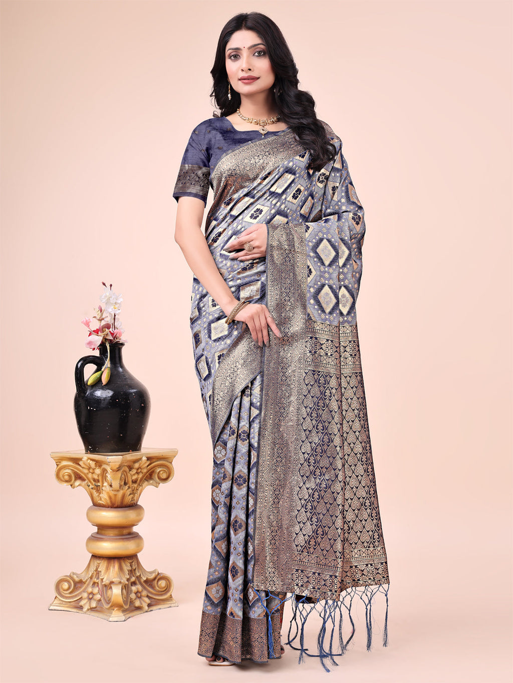 Navy Blue Lichi silk saree with contrast blue woven border and ornate floral zari design.