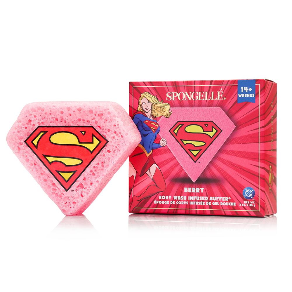 Supergirl themed pink diamond shaped body wash infused buffer sponge next to its packaging box