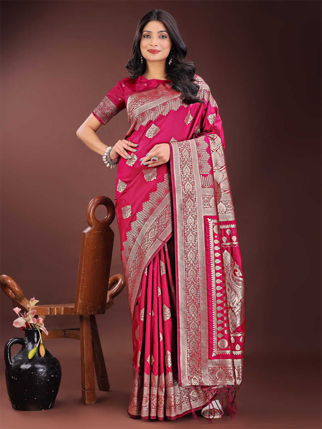 Magenta Banarasi silk saree with detailed silver zari weaving and traditional ethnic borders