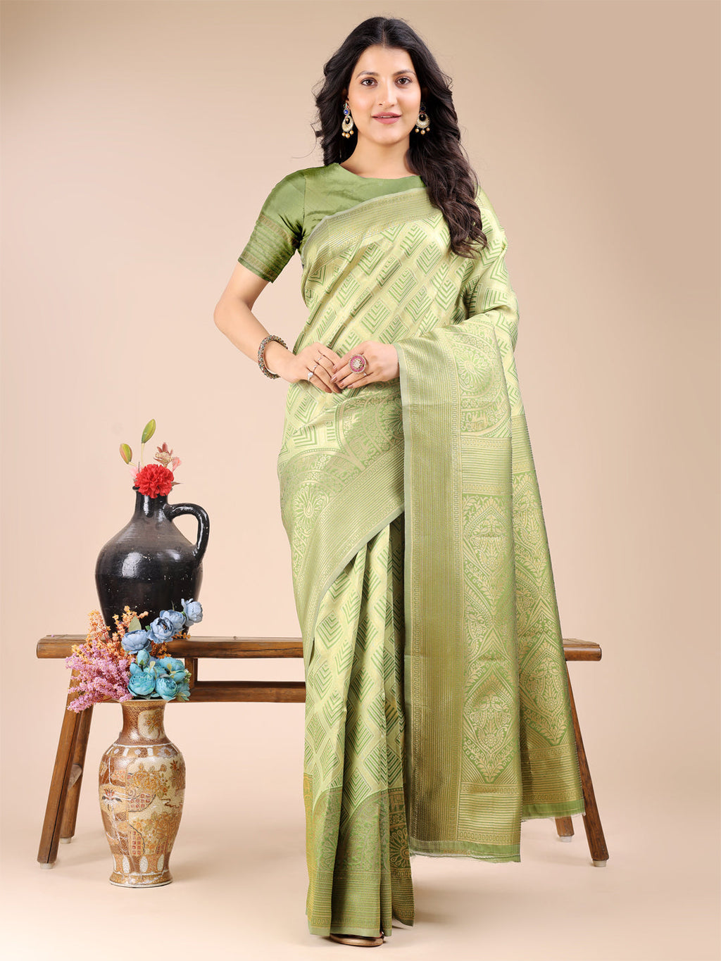 Light Green Banarasi Silk Saree with ornate gold zari work and delicate tassels on the pallu.