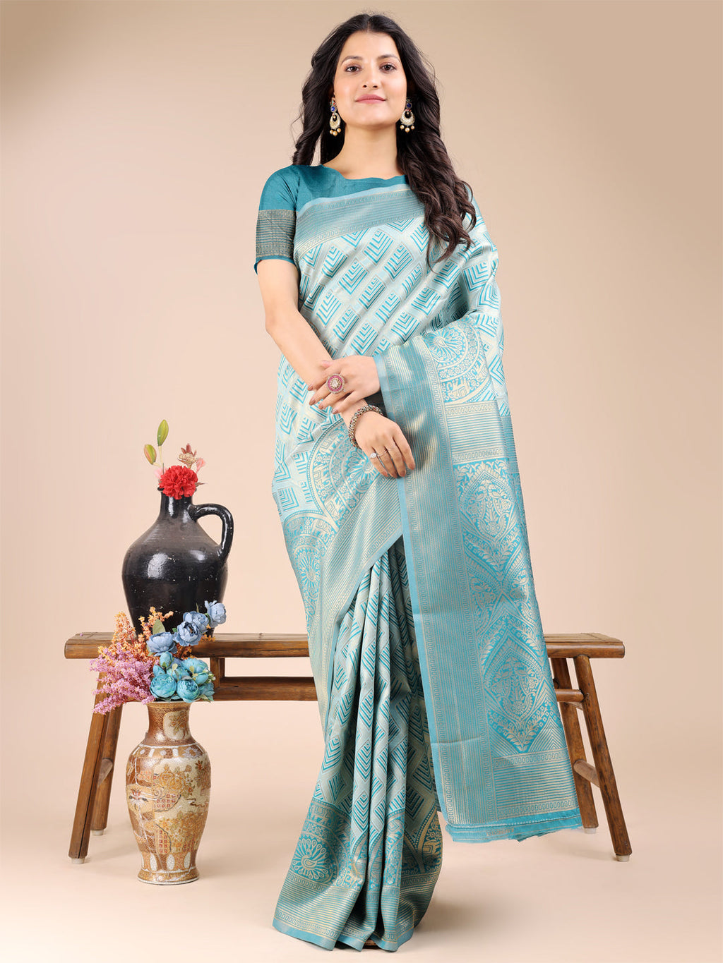 Sea green Banarasi silk saree featuring intricate gold zari weaving and decorative tassels