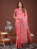 A radiant peach linen cotton Patola saree with intricate traditional patterns draped elegantly.