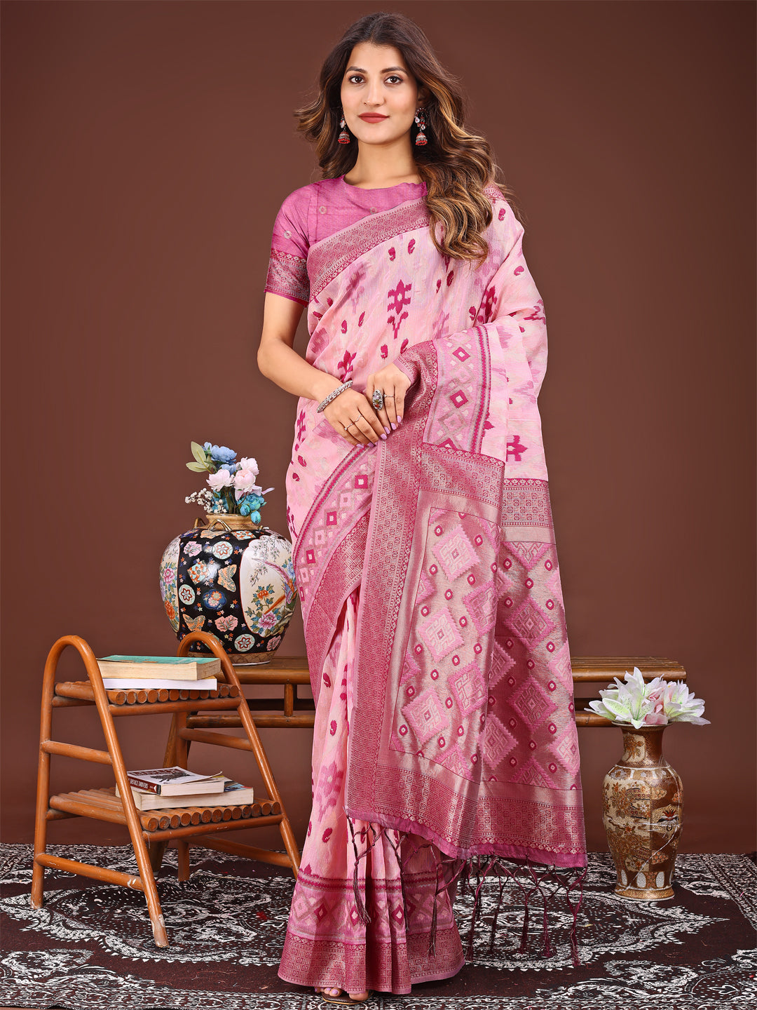 Radiant pink linen cotton saree with traditional Patola geometric patterns