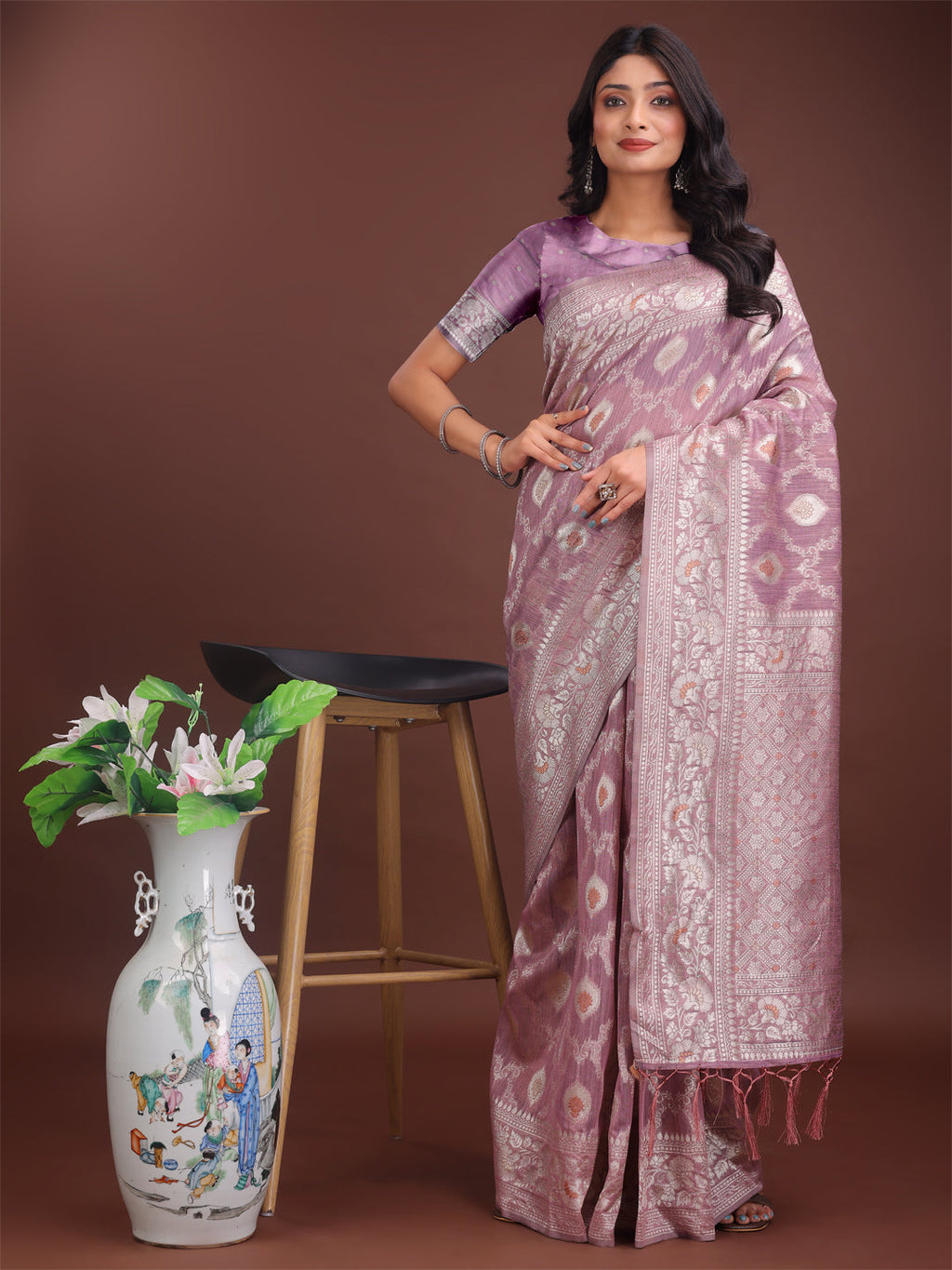Purple linen cotton saree featuring elegant silver zari weaving.