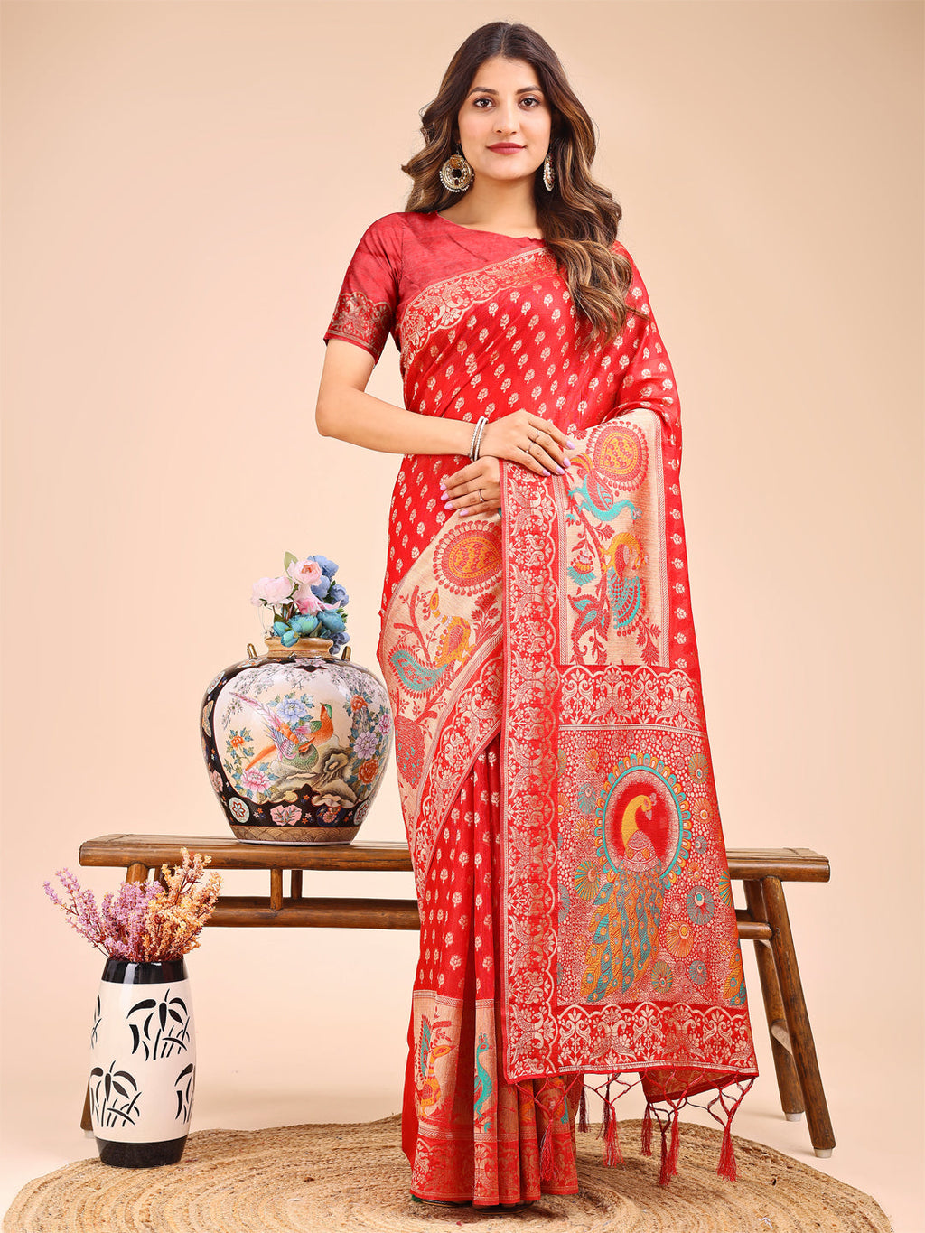 Red linen cotton saree with a detailed royal peacock motif on the pallu.
