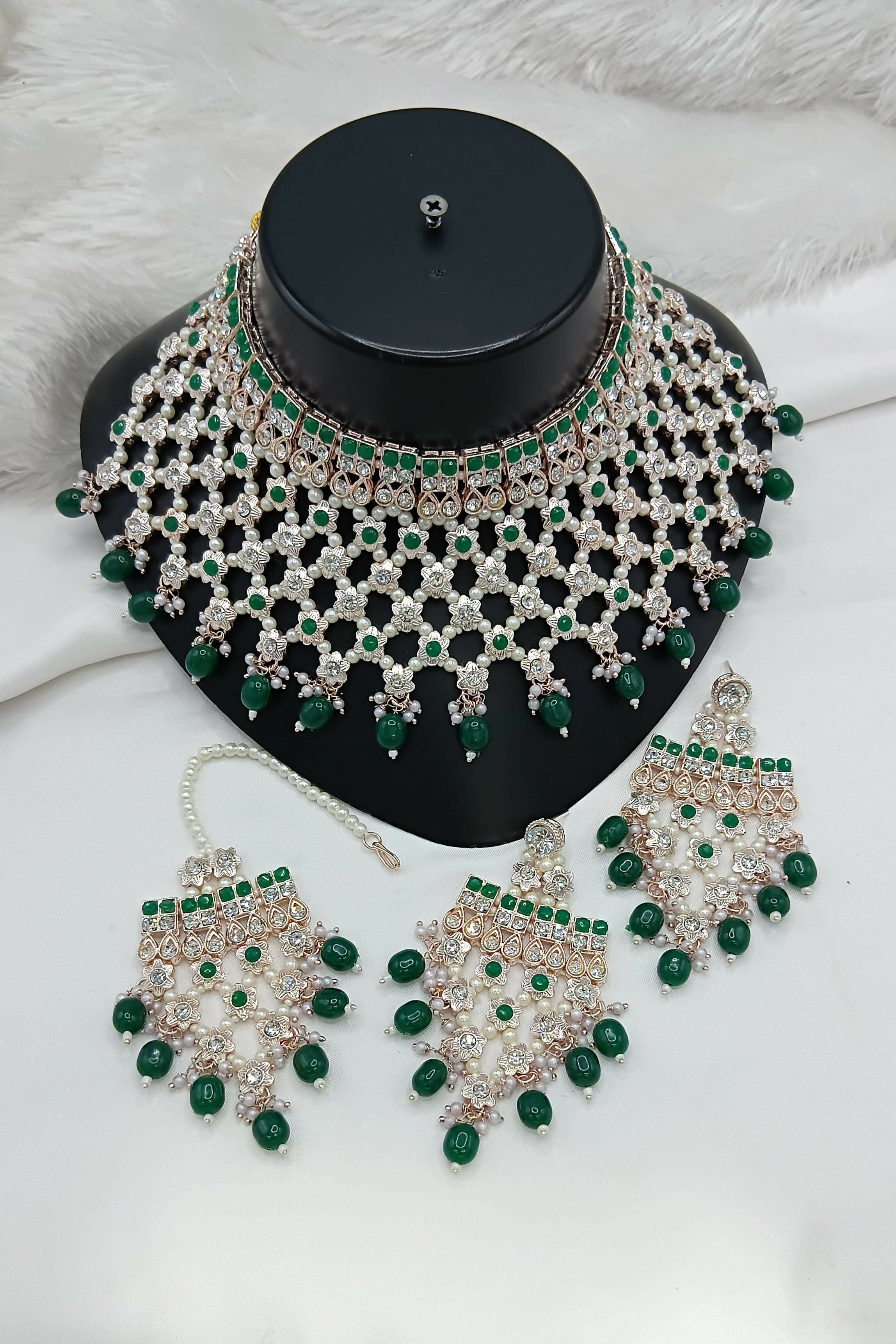 Exquisite green stone and pearl statement necklace set with matching earrings and tikka