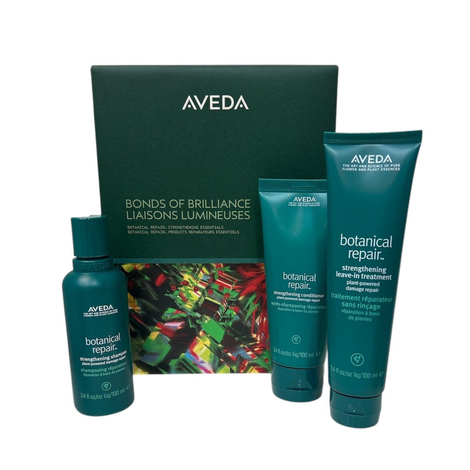 Aveda Botanical Repair Strengthening Essentials set in deep green and teal packaging with botanical design.