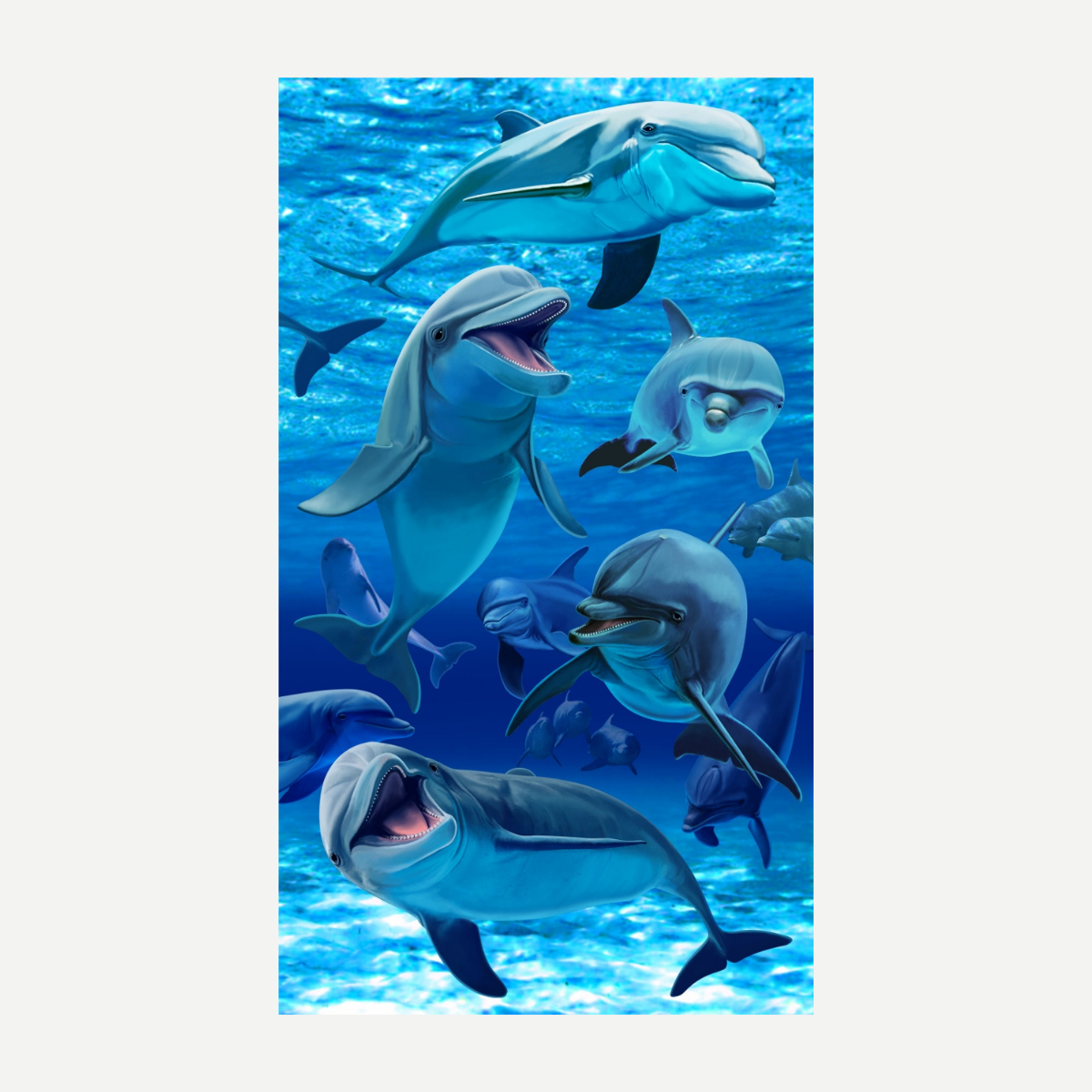 A large rectangular beach towel featuring a detailed pod of dolphins swimming in deep blue ocean water.
