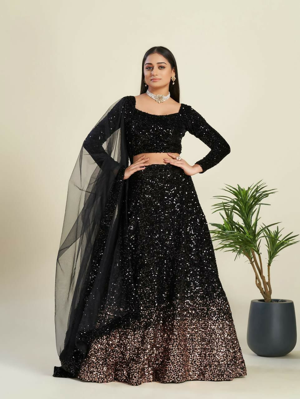 Black velvet designer lehenga choli with heavy sequins and full flare