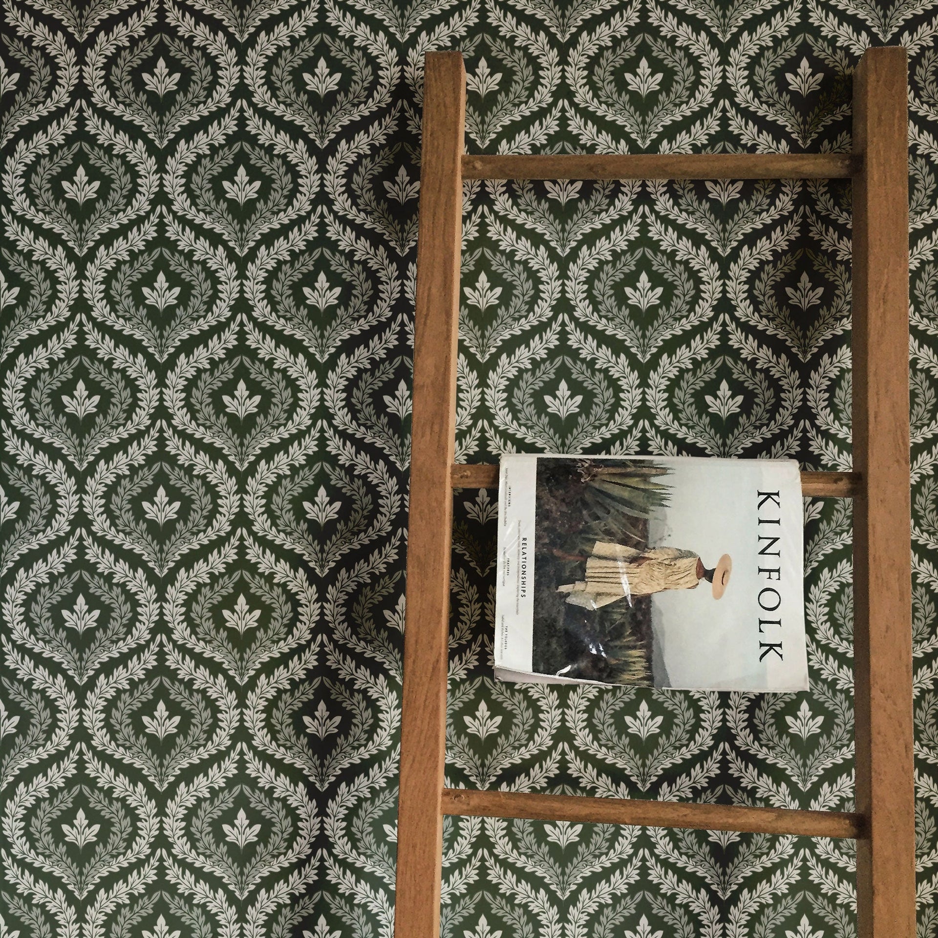 Harrison wallpaper featuring a traditional geometric pattern in dark-green and white colors.