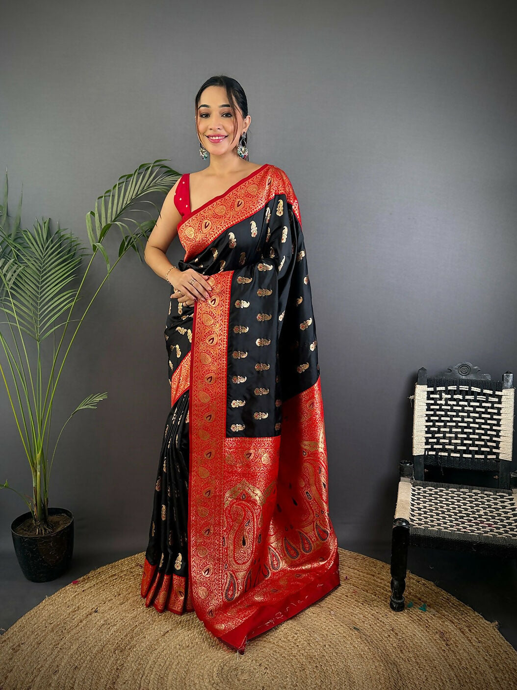 Black Banarasi soft silk saree featuring sophisticated woven butti