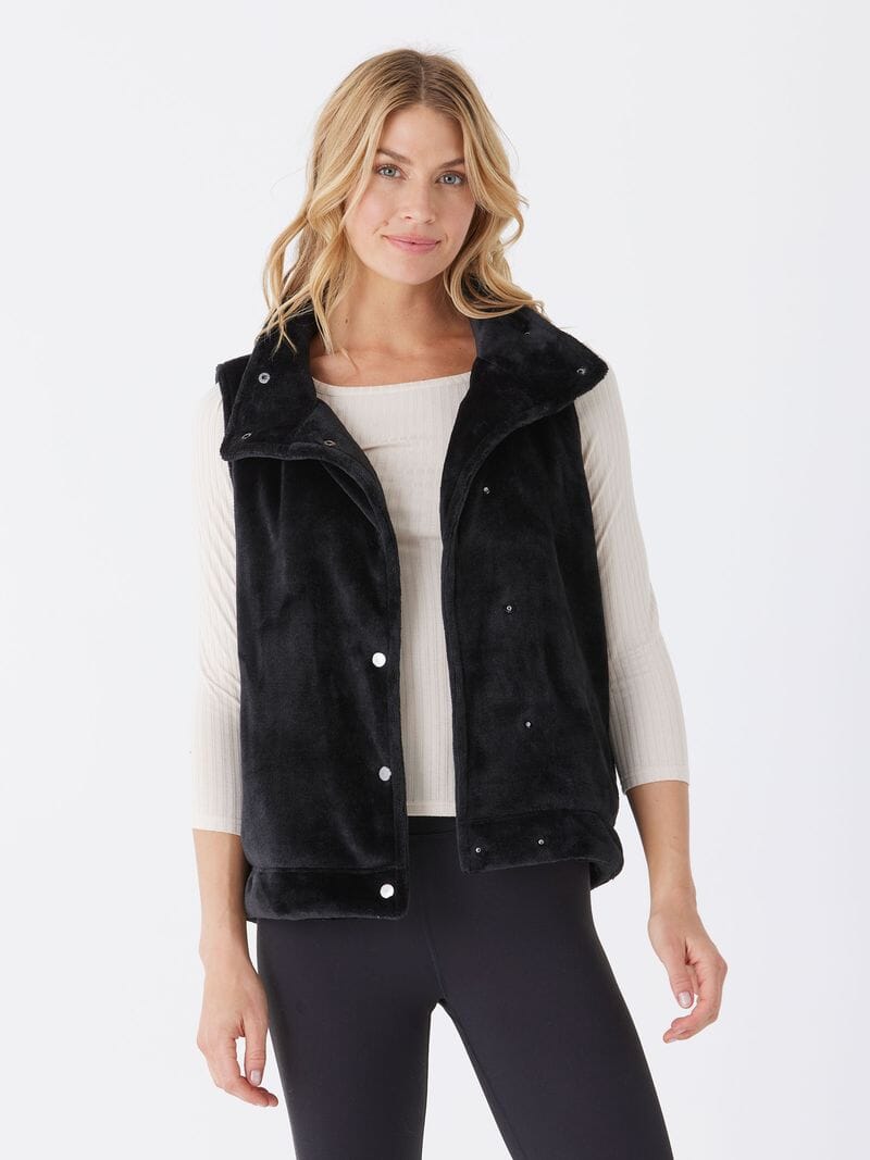 Women's Kelsey Sherpa Vest in black with snap-button closure and collared neckline.