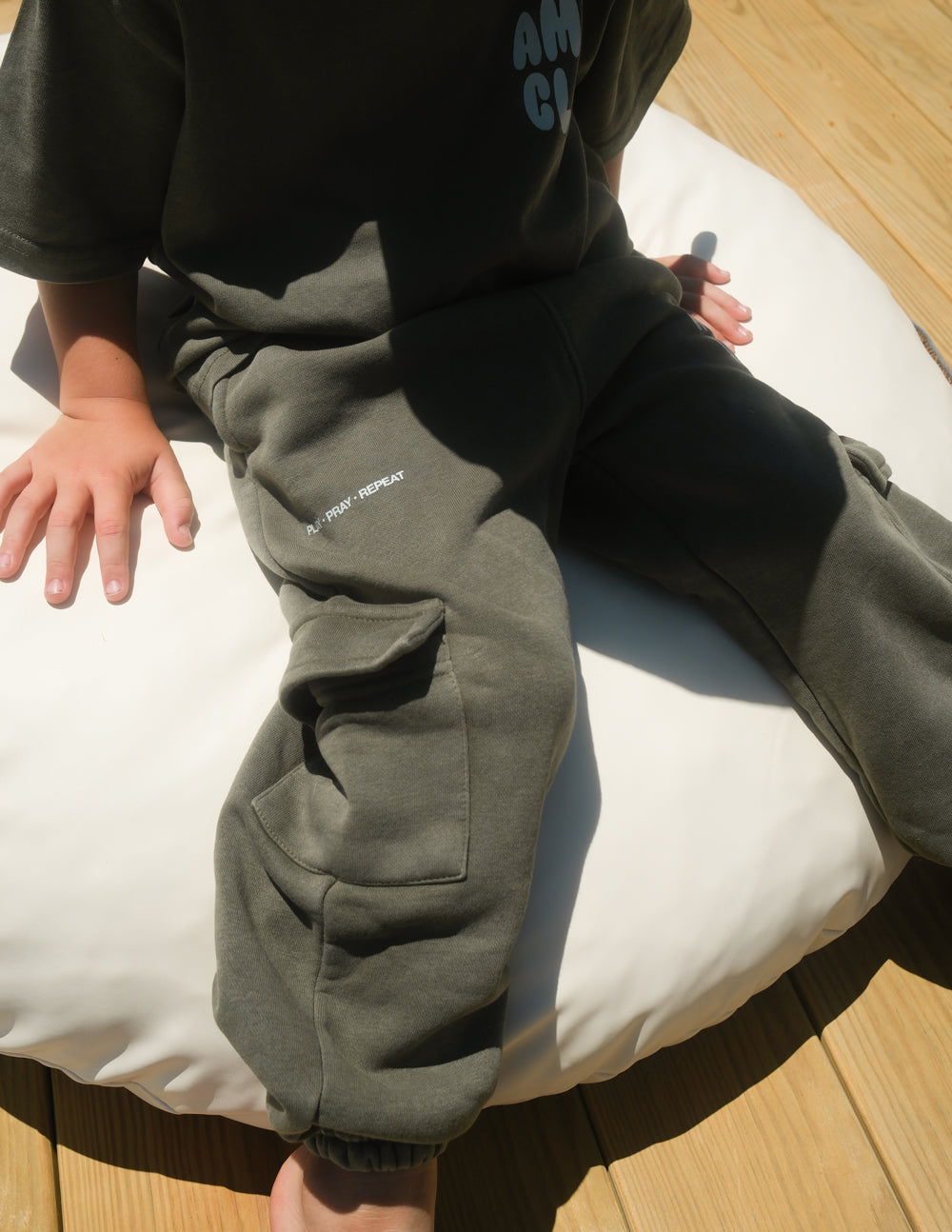 Kids wearing oversized cargo sweatpants in a casual, comfortable fit for playtime.